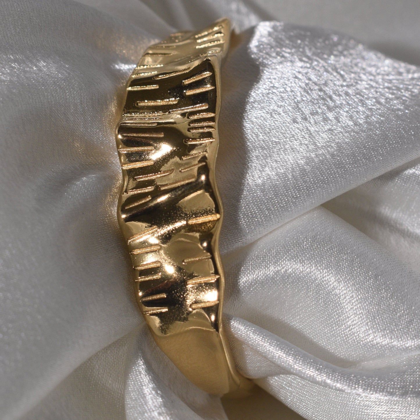 Gold-Plated Bracelet with Texture and a Distinct Wavy Pattern