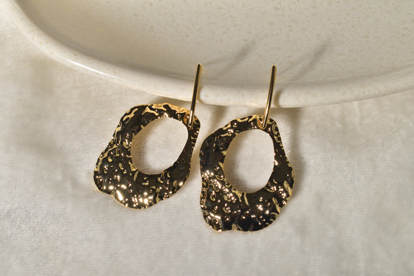 A Vibrant Statement Piece: Textured Earrings Made of Molten Gold