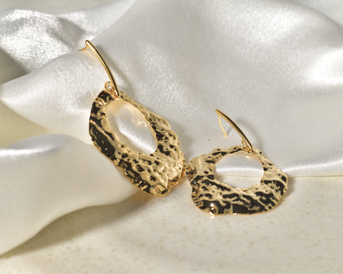 A Vibrant Statement Piece: Textured Earrings Made of Molten Gold