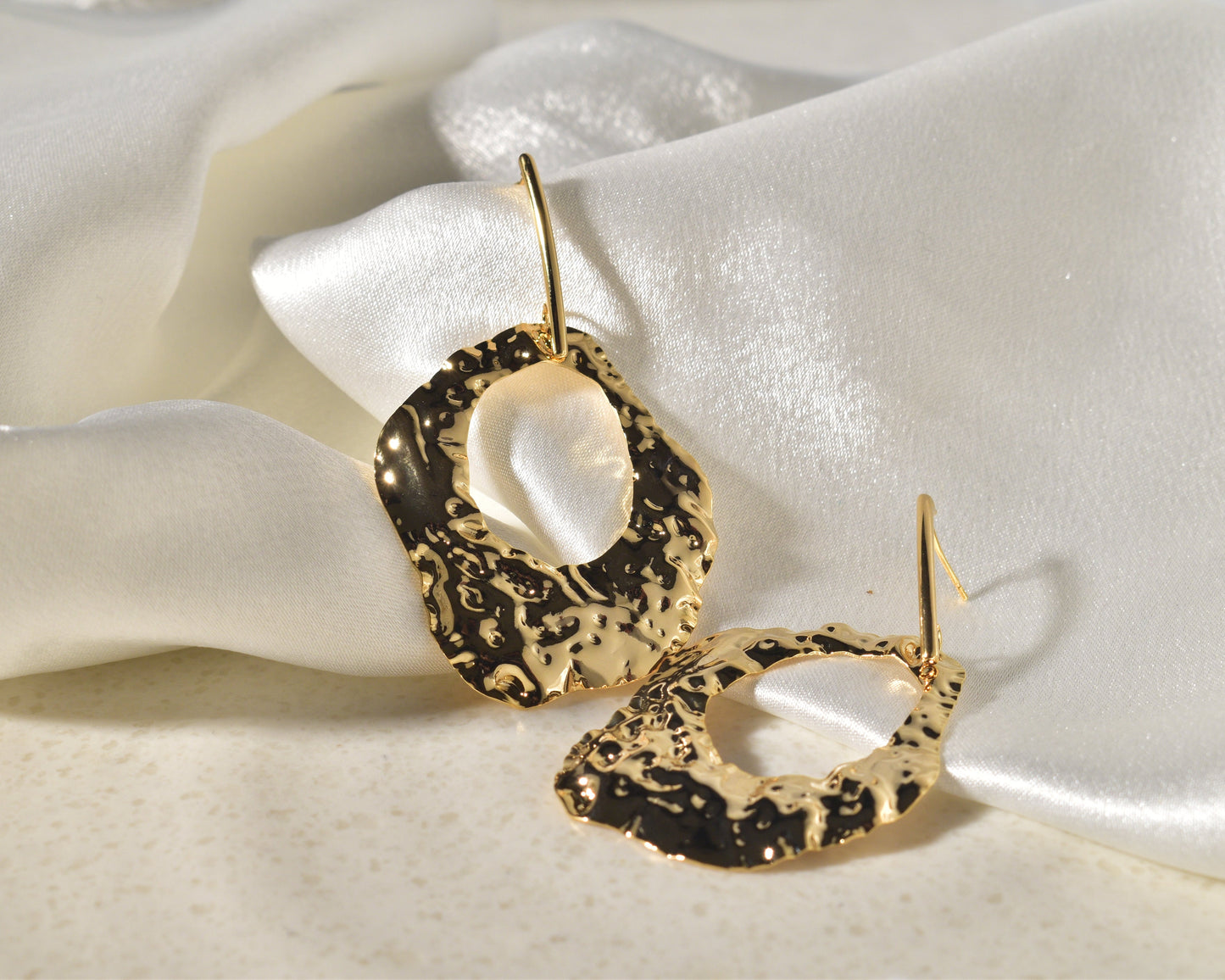 A Vibrant Statement Piece: Textured Earrings Made of Molten Gold