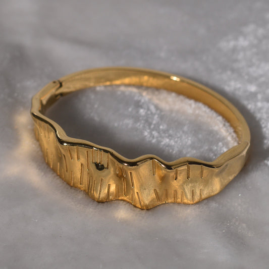 Gold-Plated Bracelet with Texture and a Distinct Wavy Pattern