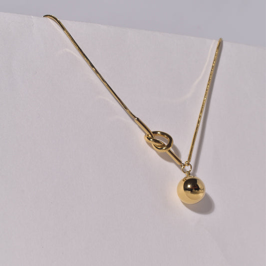 Necklace with a Golden Orb Pendant