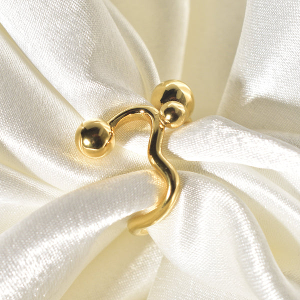 A contemporary and distinctive statement piece is the Wavy Gold Ball Ring.