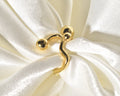 A contemporary and distinctive statement piece is the Wavy Gold Ball Ring.