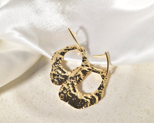 A Vibrant Statement Piece: Textured Earrings Made of Molten Gold